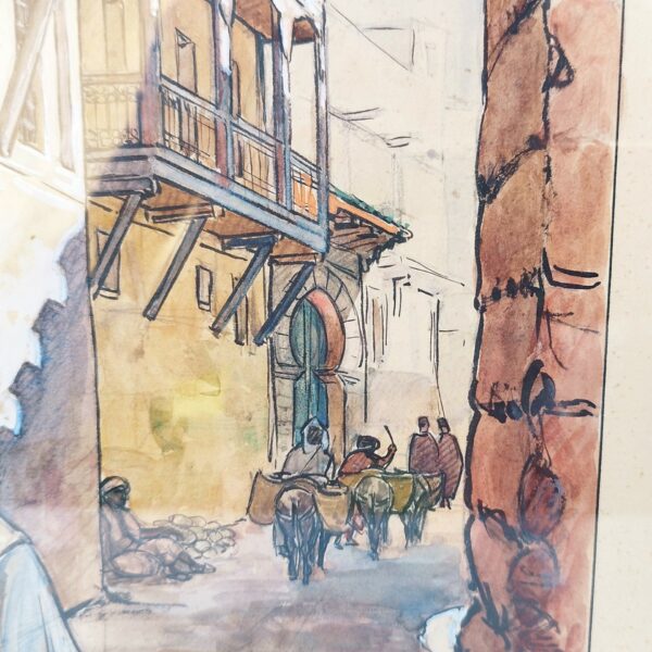 Aquarelle intitulée " Une rue de Fez " rehaussée de gouache représentant une rue de Fez avec les maisons typiques. Signé sur le bas Géo Chantriau, et daté de 1932. Petites taches d'humidité sans gravité et des rousseurs sur la marie-louise. bon état. Dimensions : 33 x 25,5 cm