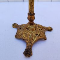 Ancien porte chapeau, présentoir de modiste ou porte perruque, postiche en bronze de la marque Siegel. Structure bronze ciselé à décor de feuille , une mollette permettant de la régler en hauteur. Repose chapeau en bois.